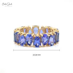 Description Charming and classy, this Tanzanite Ring pear-cut faceted eternity band is the epitome of true beauty to behold. This prong-setting engagement ring from Chordia Jewels features 24 pieces of priceless Tanzanite gemstones the size of which is 5 X 3 mm and the weight is 4.995 carats. The glitzy Tanzanite Gemstones are heated and designed in a prong setting displaying an alternative vibe all across. The purplish blue and violetish blue color of the Tanzanite crafted in a 14k solid gold b Prong Setting Engagement Ring, Stackable Wedding Ring, Tanzanite Stone, Tanzanite Ring, Blue Tanzanite, Tanzanite Gemstone, Eternity Band Ring, Ring Sale, Eternity Wedding Band