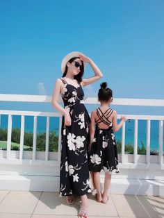 Beautiful Mommy & Me Matching black spaghetti strap dresses with beautiful all over white floral print. Criss-cross strappy back. Perfect for special occasions, events and beach days! Momma's sizes: S-L. Girls' sizes: 24M-14Y. Good things take time. Quicker shipping: this dress ships directly to you from our overseas warehouse, and will arrive in approximately 7-10 business days. Black Spaghetti Strap Dress, Flora Dress, Things Take Time, Black Spaghetti Strap, Black Spaghetti, Strap Dresses, Good Things Take Time, Beach Days, Take Time