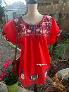 "Blouse STYLE DETAILS Overview * soft cotton fabric * round-neck * hand embroidered design * short sleeves * mid thigh Fit & sizing Red: 37\" Bust (all around) 33\" Long Beige: 38\" Bust (all around) 33\" Long Black 1: 38\" Bust (all around) 33\" Long Black 2: 38\" Bust (all around) 33\" Long Magenta: 34\" Bust (all around) 29\" Long Green: 38\" Bust (all around) 33\" Long Purple: 37\" Bust (all around) 33\" Long Hot Pink: 36\" Bust (all around) 28\" Long Yellow: 39\" Bust (all around) 33\" Relaxed Fit Blouse With Floral Embroidery And Short Sleeves, Summer Embroidered Short Sleeve Top With Relaxed Fit, Spring Short Sleeve Blouse With Tonal Embroidery, Red Bohemian Crew Neck Blouse, Fitted Short Sleeve Embroidered Top, Fitted Short Sleeve Top With Embroidered Hem, Red Crew Neck Blouse With Floral Embroidery, Traditional Short Sleeve Blouse With Tonal Embroidery, Embroidered Short Sleeve Blouse With Relaxed Fit