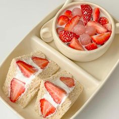 two slices of cake with strawberries and ice cream