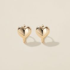 Heart goes padam padam in these hoops. Boo’s chubby heart motif, set on a 6mm huggie, are the sweetest addition to your ear stack. Minimal, sophisticated and chic, these shapely hoops will have hearts skipping beats. Created for you in the finest 14 karat gold, you'll want to wear these earrings always and never take them off, even when working out or in the shower. Padam Padam, Huggie Earrings Gold, Heart Motif, Ear Stack, Helix Piercing, Huggie Earrings, Recycled Gold, Polish Jewelry, Huggies Earrings