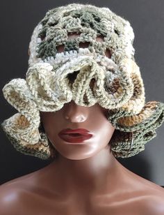 a mannequin head wearing a crocheted hat