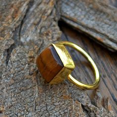 Natural Tiger Eye Gemstone gold ring, 14k yellow gold Chalcedony ring, Tiger Eye jewelry,beautiful gift, gold ring, gift fot her, Tiger Eye The 14K yellow solid gold bezel and solid yellow gold ring are both shined to an extremely high polish. All rings are packaged and shipped in a beautiful ring box. The main stone is natural, shiny, Tiger Eye. Gemstone Size Approx : 9 mm The pictures have been enlarged to show the details. The price is for a 14k gold ring, if you want to order the ring in 18k Rectangular Yellow Gold Ring With Gemstone, Handmade Yellow Gold Rectangular Rings, Gemstone Gold Ring, Prasiolite Ring, Tiger Eye Ring, Gold Tiger, Gold Tiger Eye, Tiger Eye Jewelry, Tiger Eye Gemstone