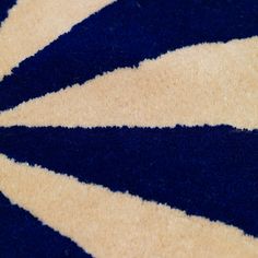 a close up view of a blue and white rug