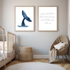 two framed whale prints in a baby's room with a crib and rocking chair