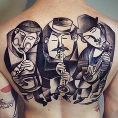 a man's back with three men on it and one is holding a guitar