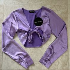 White Fox Boutique Girls Vacay Long Sleeve Tie Front Satin Purple Crop Top Size Xs Nwt Chic Purple Long Sleeve Crop Top, Chic Long Sleeve Purple Crop Top, Fitted Purple V-neck Crop Top, Fitted V-neck Purple Crop Top, Purple Crop Top, White Fox Boutique, Girls Boutique, Purple Top, White Fox