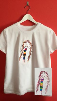 a white t - shirt with a drawing of a girl on it