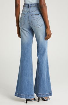 A high-rise waist and flared legs dial up the throwback charm of comfy organic cotton–blend jeans finished with a faded, vintage-inspired wash. 31" inseam, 24" leg opening; 11 1/2" front rise; 15 1/2" back rise (size 29) Zip fly with button closure Five-pocket style 99% organic cotton, 1% elastane Machine wash, line dry Imported Retro High Rise Flare Jeans With Frayed Hem, Casual Cotton Flares With Frayed Hem, Casual Denim Flares With Frayed Hem, Mid-rise Cotton Flares With Frayed Hem, Retro Denim Blue Flared Denim Pants, Retro Denim Flare Jeans With Frayed Hem, Retro Flare Jeans With Frayed Hem, Casual High Rise Flares In Medium Wash, Retro Denim Blue Flares