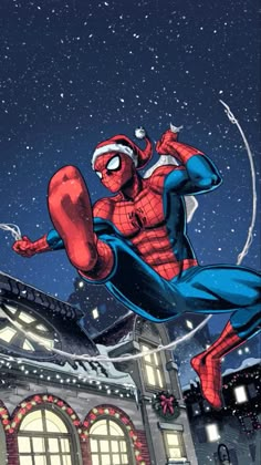 spider - man flying through the air in front of a building with christmas lights on it