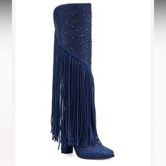 a pair of blue boots with fringes on the side and heeled heels in front