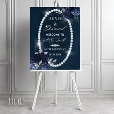 a sign with pearls and flowers on it in front of a white wall that says denim and diamond welcome to all of us