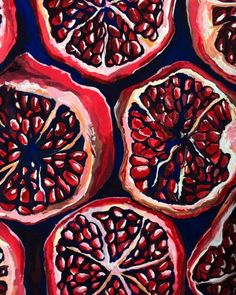 a painting of pomegranates cut in half