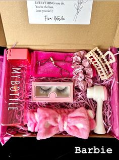 a box filled with fake eyelashes and other items to make it look like a doll