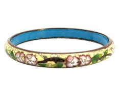 "This is from my personal collection. I received this beautiful bracelet from my mother in 1978 as a young stylish and headstrong woman of the 1970s. I wore it with pride for many years. It is a gold wire on enamel the cloisonne is a beautiful floral detail. They are genuine and come with my personal provenance. These are authentic 1978 Bohemian styles. They were purchased likely from Emporium Capwell in Fremont, CA. Fashion enamel jewelry decorated with gorgeous brightly colored flowers and pat Vintage Collectible Bracelets, Collectible Vintage Bracelets, Retro Handmade Bangle Jewelry, Vintage Multicolor Cuff Bracelet Collectible, Vintage Jubilee Cuff Bracelet As Gift, Vintage Jubilee Cuff Bracelet Gift, Vintage Bangle Bracelets For Gift, Vintage Jubilee Bangle As Gift, Antique Blue Round Bracelets