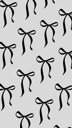 black and white bows on grey background for wallpaper or fabric design, seamless