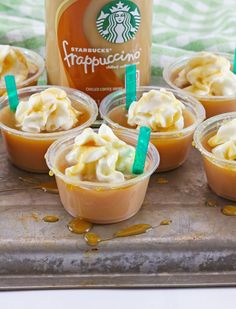 small cups filled with caramel and whipped cream