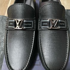 Louis Men’s Size 5 Us Men’s Size 7 Black All-Leather Louis Vuitton Loafers With Silver Hardware. Never Worn. Brand New With Original Box! Feel Free To Ask Any Questions If Needed Or Make Offers. The Loafers Were Just A Little Bit Too Big For My Girlfriend. Luxury Slip-on Dress Shoes, Luxury Black Slip-on Dress Shoes, Silver Loafers With Leather Sole For Business, Luxury Silver Loafers With Round Toe, Designer Black Business Loafers, Luxury Silver Loafers For Business, Luxury Black Dress Shoes, Classic Silver Loafers For Business, Luxury Silver Loafers For Formal Occasions