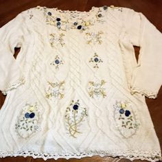 Vintage New Tunic Sweater Hand-Made Decorated With Ribbons, Navy Roses, Pearls, Beautiful Crochet Trim. Unique Rare Sweater. You Will Be The Only Woman Wearing This Stunning Sweater. Size Small (Runs Large). Navy Blue Roses, Green Stitching, Light Blue Ribbon Flowers, White Ribbon Flowers, White Pearls. High Quality Workmanship. Navy Blue Roses, Light Blue Ribbon, Flowers White, Blue Roses, Knit Tunic, White Ribbon, Crochet Trim, Ribbon Flowers, Tunic Sweater