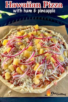 hawaiian pizza with ham and pineapple on top