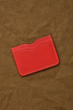 Back view of Akira Wallet in Persimmon Red Leather Everyday Card Holder, Leather Card Holder With Flat Pocket For Everyday Use, Everyday Rectangular Wallets With Flat Pocket, Red Card Holder With Interior Slots For Everyday Use, Everyday Red Card Holder With Rfid Blocking, Casual Coin Purse With Card Slots For Everyday, Red Rfid Blocking Card Holder For Everyday Use, Casual Everyday Card Holder With Coin Pocket, Red Rfid Blocking Wallets For Everyday Use