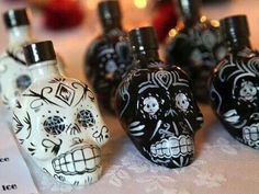 there are many skulls in the bottles on the table