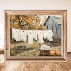 an oil painting of clothes hanging on a line with pumpkins in the foreground