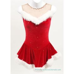 a red dress with white fur trims on it