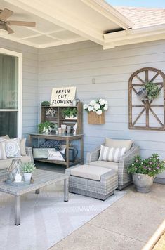 a patio with couches, chairs and tables on it