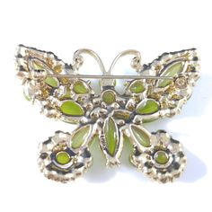 *Description: This is a beautiful light green butterfly brooch by Monet with glass cabochons which look like moonstone as it moves under the light. In addition to the glass cabochons are light green rhinestones on a gold tone background. This would be a great addition to your vintage jewelry collection or make a great vintage gift! *Approximate Measurements: Length - 2 Inches, Width - 2 1/4 Inches *Condition: Great vintage condition. Will see signs of wear under magnification. See photos for det Light Green Butterfly, Green Moonstone, Formal Earrings, Vintage Christmas Gifts, Book Pieces, Green Butterfly, Butterfly Brooch, Under The Lights, 1950s Vintage