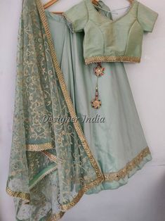 Looking for something special and unique to wear at your wedding? Look no further than our mint green lehenga choli dupatta! This beautiful piece of party wear is designed by one of India's leading fashion designers, and is perfect for bridesmaids, female guests, or even yourself as the bride. Made from tafetta silk fabric with a delicate mint green color, this lehenga choli dupatta will add an elegant touch to any outfit you choose to wear it with. Don't miss out on this must-have item for your Unstitched Lehenga In Pista Green Raw Silk, Unstitched Pista Green Chanderi Lehenga, Unstitched Pista Green Lehenga In Raw Silk, Unstitched Pista Green Dola Silk Lehenga, Pista Green Raw Silk Lehenga For Eid, Unstitched Pista Green Silk Lehenga, Unstitched Pista Green Lehenga With Gota Work, Pista Green Sets With Unstitched Blouse, Semi-stitched, Pista Green Dola Silk Set With Unstitched Blouse