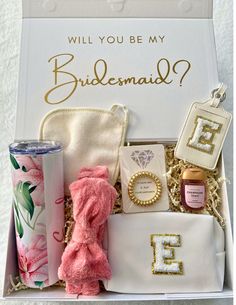 the bridesmaid gift box is filled with personal items