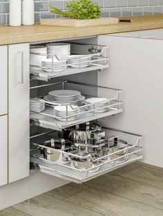 an open cabinet in a kitchen filled with dishes