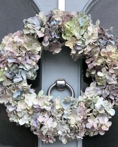 a wreath is hanging on the front door