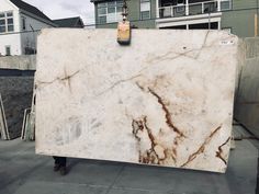 a large marble slab sitting on top of a sidewalk