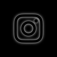 the instagram logo is shown in black and white with light coming from behind it