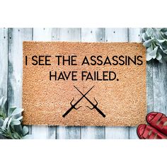 a door mat that says, i see theassins have failed