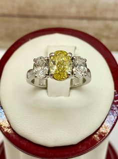 Welcome to Gold Knox Stunning 18k white solid gold statement ring. The all three diamonds are oval brilliant cut and set on four prong setting. Great piece and gift idea for any special occasion. Details below: Material 18k white gold, yellow gold, white gold Ring Size 5 1/4 US Hallmark 750 Center Stone Diamond 1.45Ct Clarity VS1 Color Fancy Yellow Side Stones Diamond .60 each Clarity VS1 Color E This would make great addition to your jewelry collection. Thank you for looking SHIPS SAME DAY PLEA Pink Diamond Band, Light Blue Gemstone, Gold Statement Ring, Turquoise Bracelet Cuff, Turquoise Cuff, White Solid, White Gold Ring, Yellow Diamond, Pink Diamond