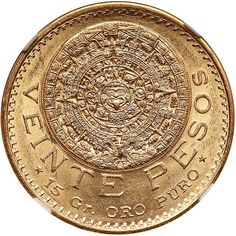 a gold coin with an image of the sun on it