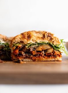 a close up of a sandwich on a cutting board