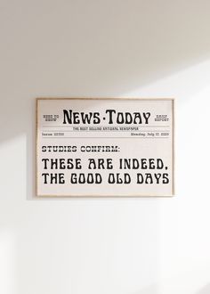 an old newspaper advertises news today on the wall in a room with white walls