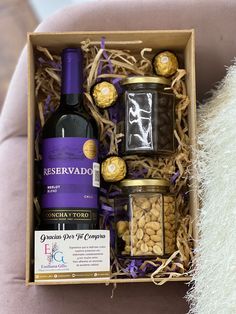 a wine bottle and some nuts in a box