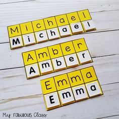 two scrabble tiles with the words michael and amber emma written on them