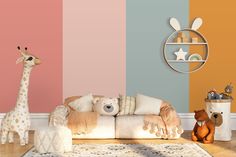 two stuffed animals sitting on top of a couch in front of a wall with multicolored stripes