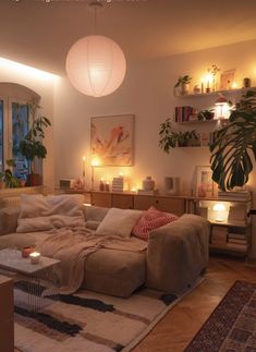 a living room filled with furniture and candles