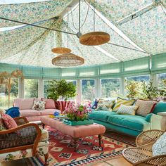 a living room filled with lots of colorful furniture