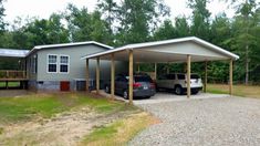 two cars are parked in front of a house with carports on both sides