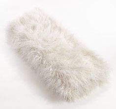 a white furry object on a white background