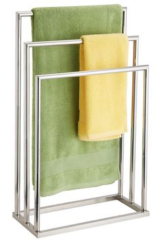 a towel rack with two towels on it and one folded up in front of the other