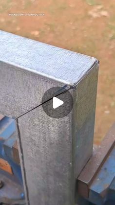 a metal object with a video playing on it's front end in the process of being assembled